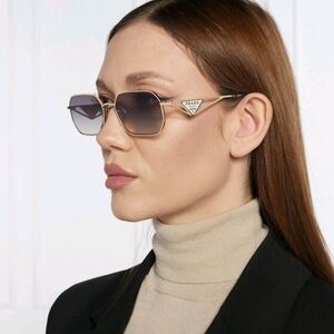 Prada A 51s Sunglasses with Gold Frame and Brown Gradient Gray Lenses